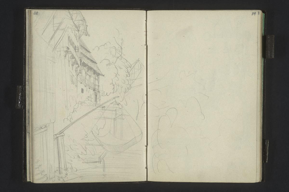 Häuser am Wasser, vorn ein Fischnetz