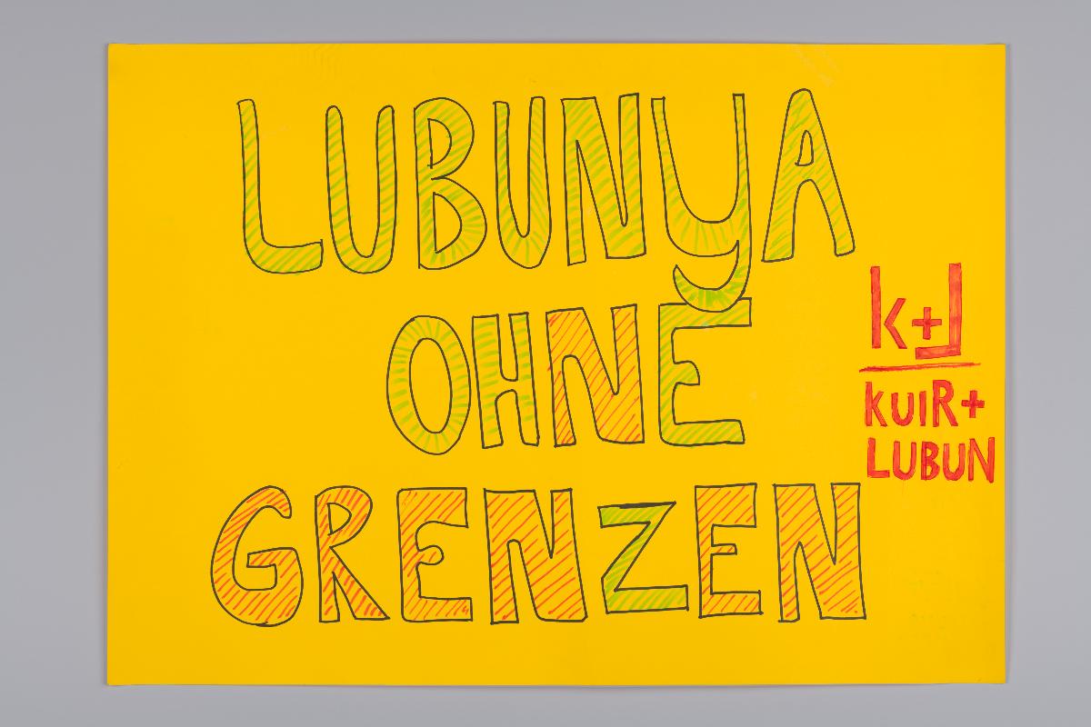 Vorderseite "Trans-National"; Rückseite "Lubunya Ohne Grenzen"