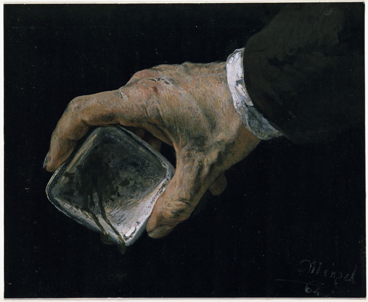 Hand des Künstlers mit Farbnapf