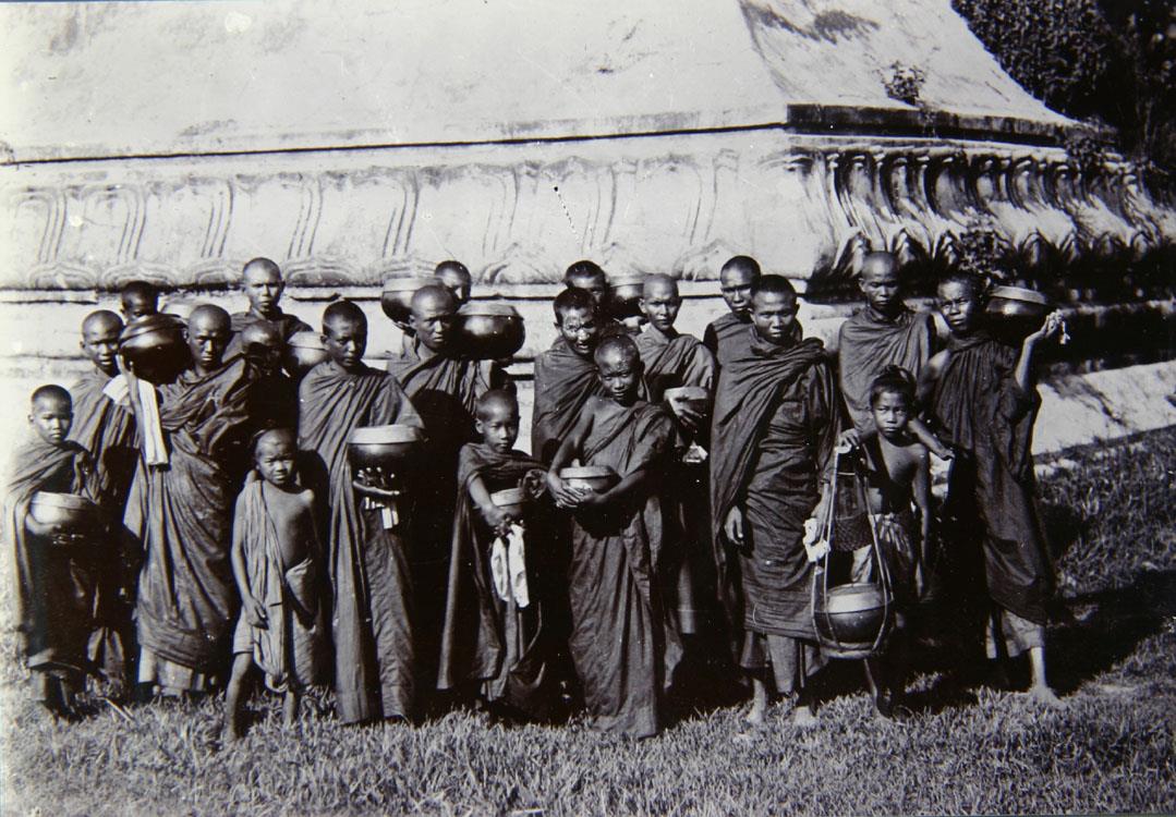 Hpoongyies (Buddist priests) with Their begging bowls ready to go out begging