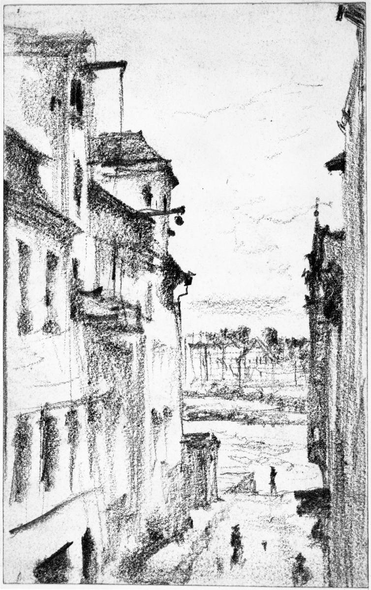 Blick durch eine Straße auf Gebäude hinter dem Fluss