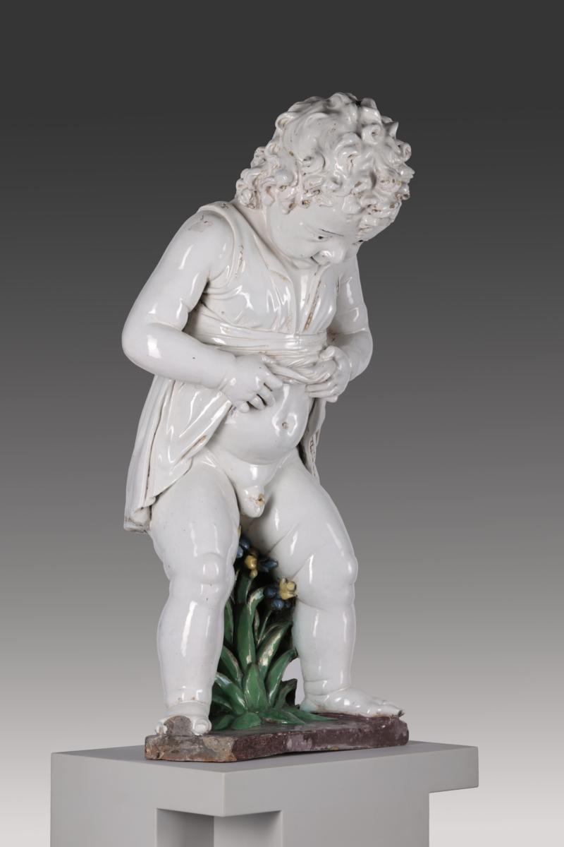 Pinkelnder Knabe als Brunnenfigur