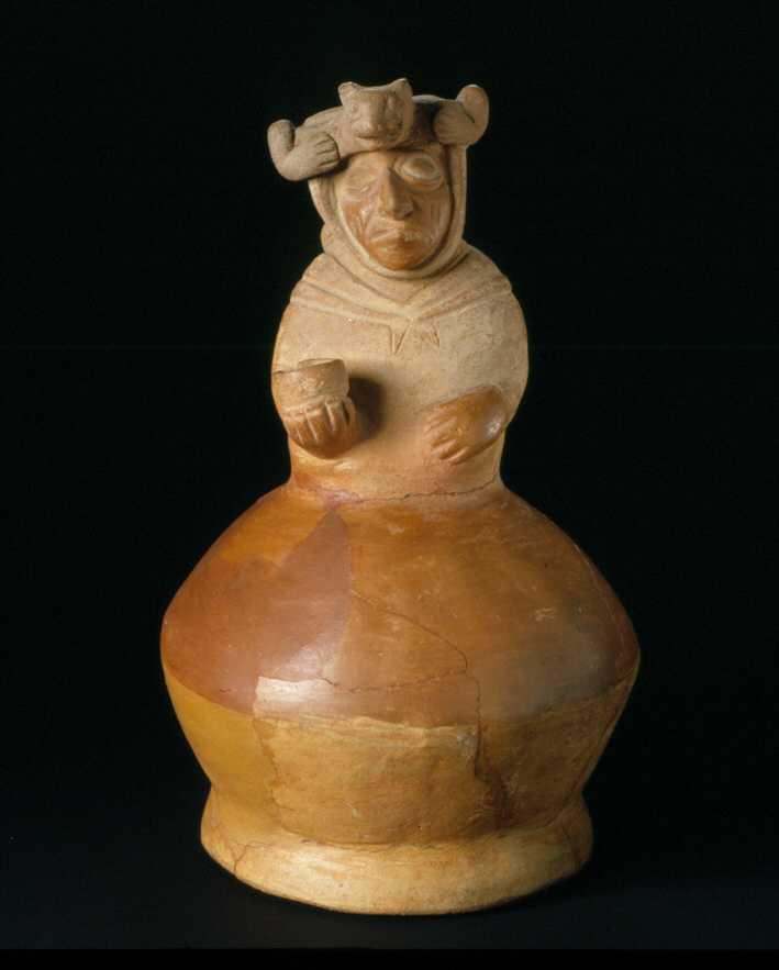 Application: anthropomorphic seated figure with bowl, one-eyed