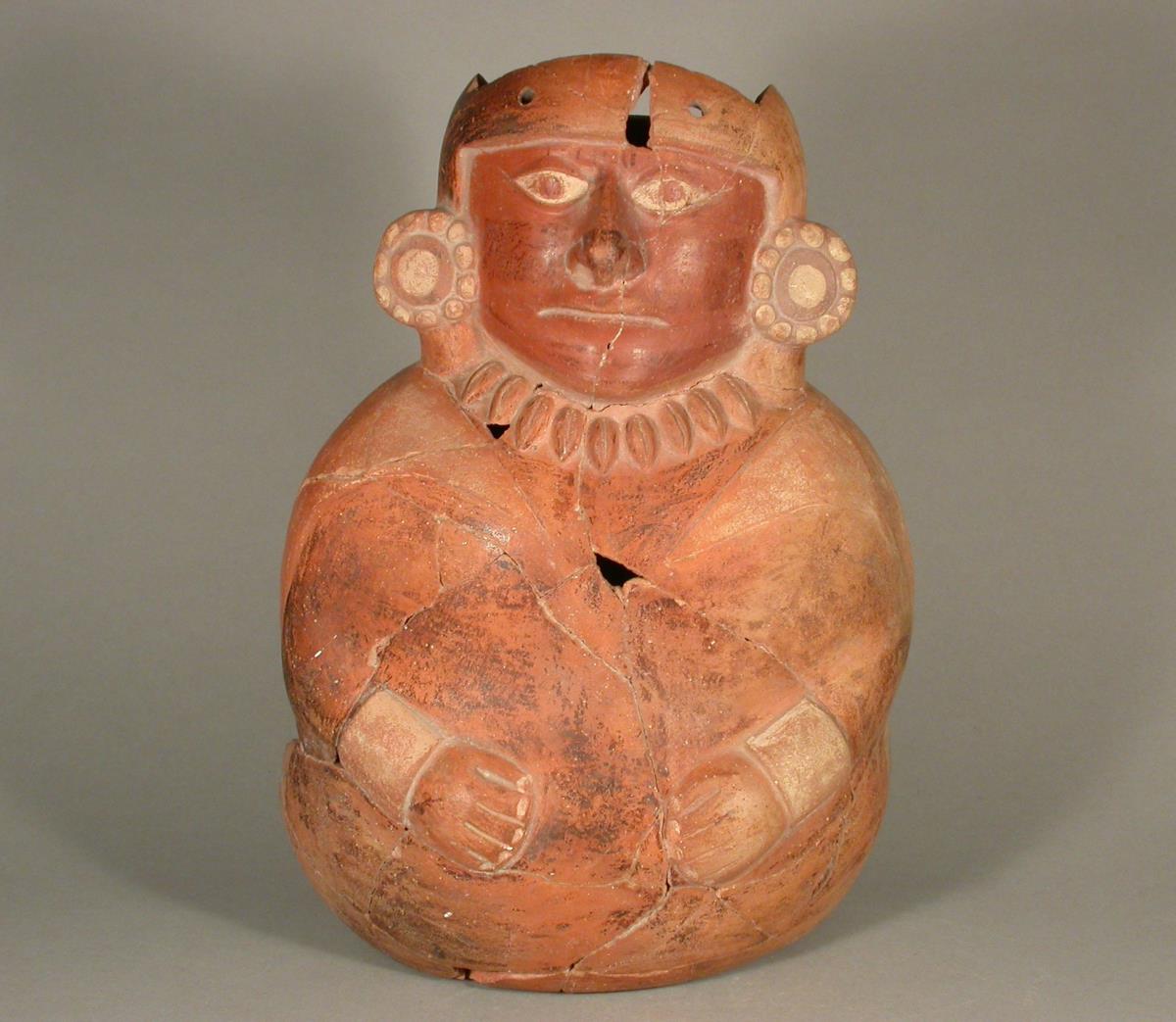 Sitzende anthropomorphe Figur