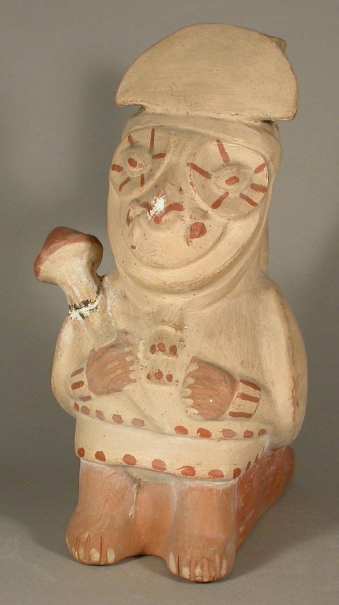 Stehende anthropo-zoomorphe Figur (Vogel/Eule) mit Keule