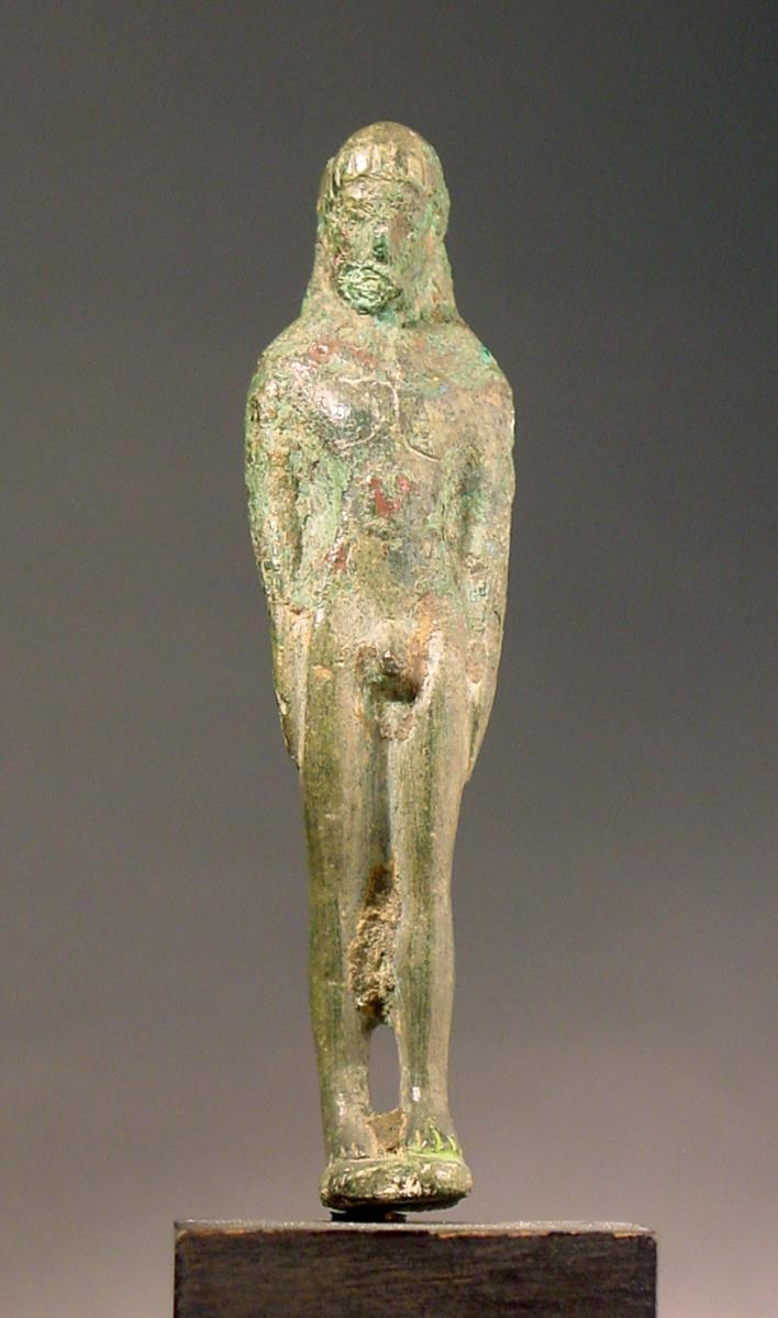 Archaische (?) Statuette eines Jünglings im Kurosschema