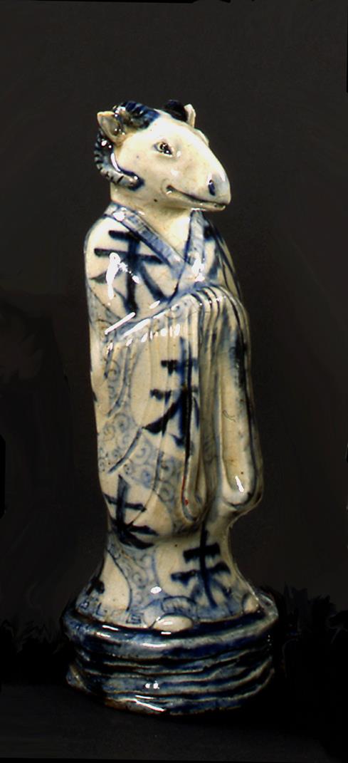 Beamtenfigur mit Rindskopf (aus einem Tierkreis-Zyklus)