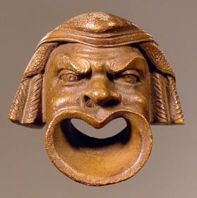 Applik in Form einer komischen Schauspielermaske