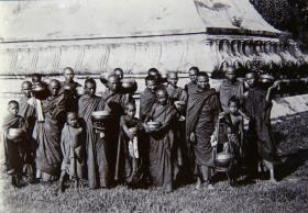 Hpoongyies (Buddist priests) with Their begging bowls ready to go out begging