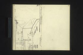 Gasse mit Bergen im Hintergrund