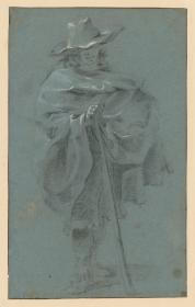 Stehender Mann mit Schlapphut und Überwurf