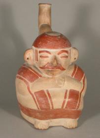 Sitzende anthropomorphe Figur mit Bart