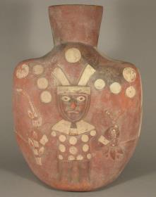 Relief: stehende anthropomorphe Figur mit Kulturpflanzen