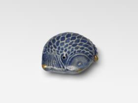 Wassertropfer in Form eines Fisches